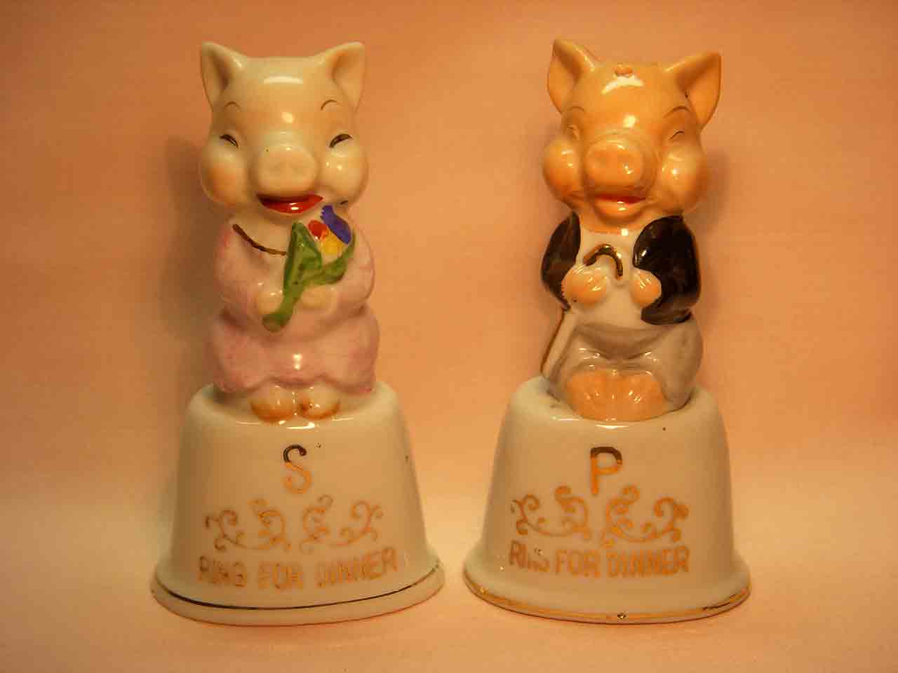 Vintage dressed pigs on dinner bells salt and pepper shakers