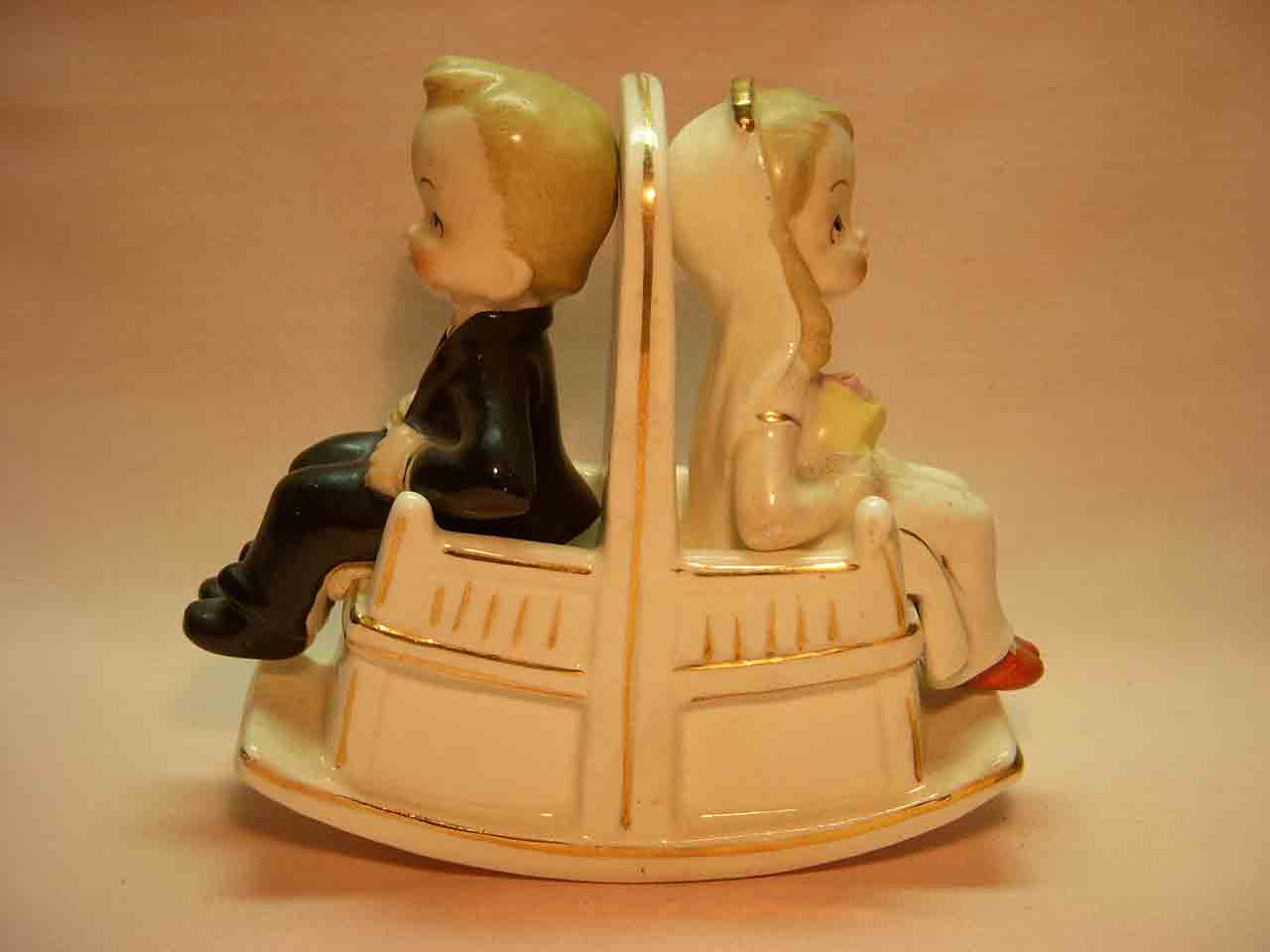 Bride and groom sitting in double rocking chair salt and pepper shaker