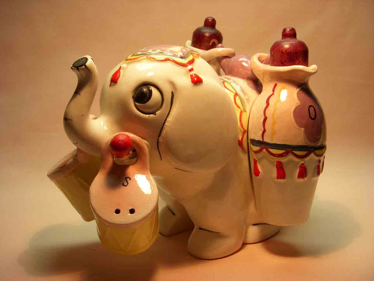 Elephant carrier with hanging oil and vinegar salt and pepper shaker