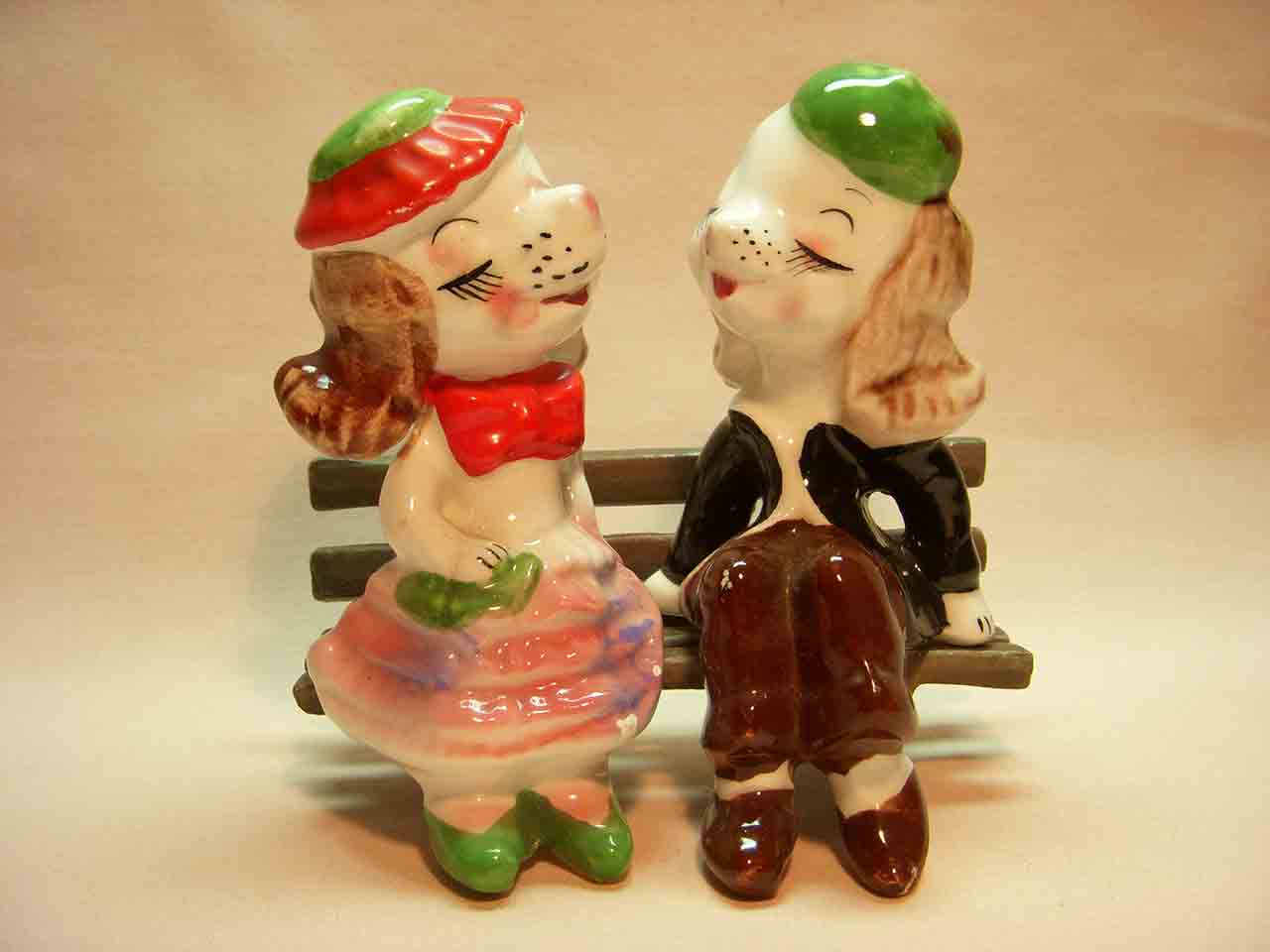Dog couple bench sitters on wooden bench salt and pepper shaker